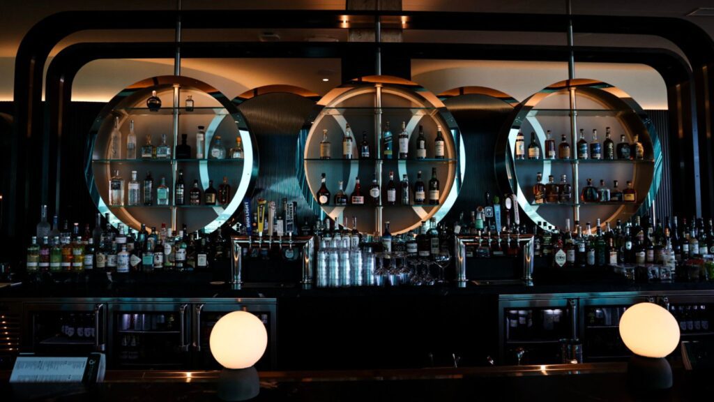 The bar at 360 Westport is lined with globe lights.