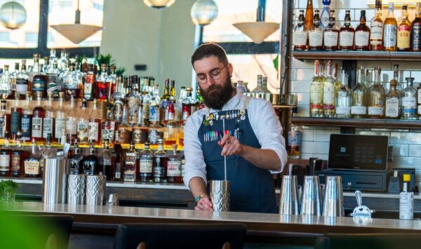 Bar manager Jeramy White mixes drinks at Olive and Oak.
