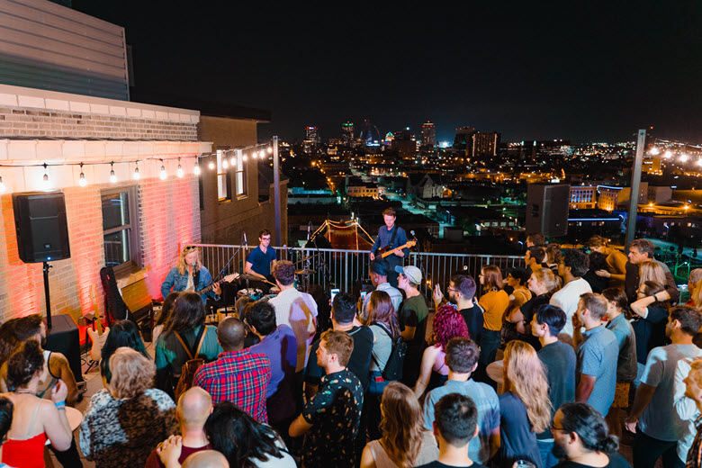 A concert at ART Bar on the outdoor rooftop lounge and bar with sweeping views including the Saint Louis city skyline.