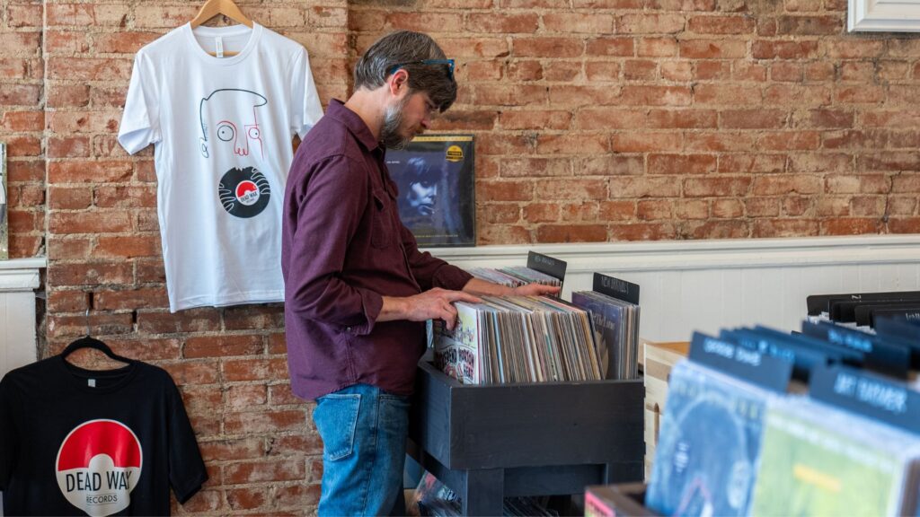 A man shops for vinyl records at Dead Wax Records.