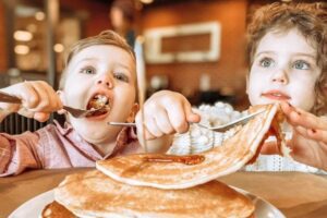 Kids dig into pancakes at Eckert's Country Restaurant.