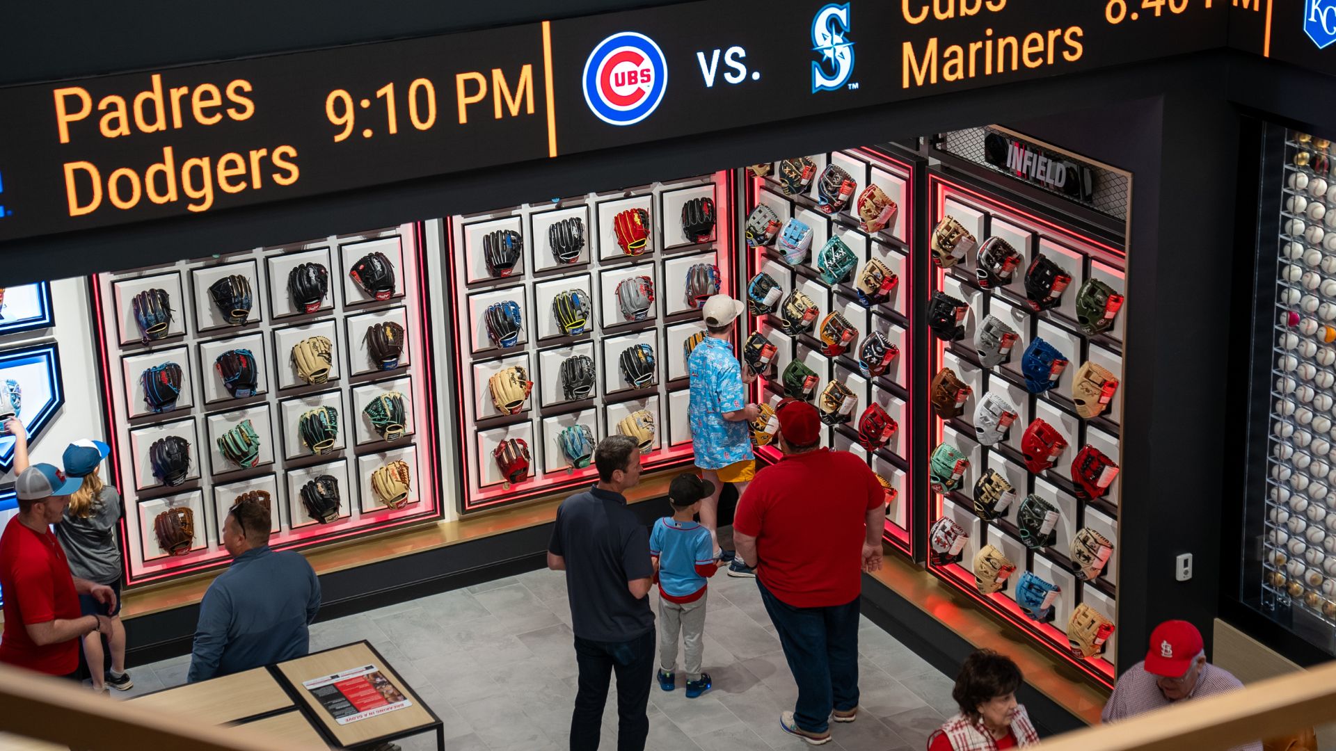 People shop for baseball gloves at the Rawlings Experience in St. Louis.