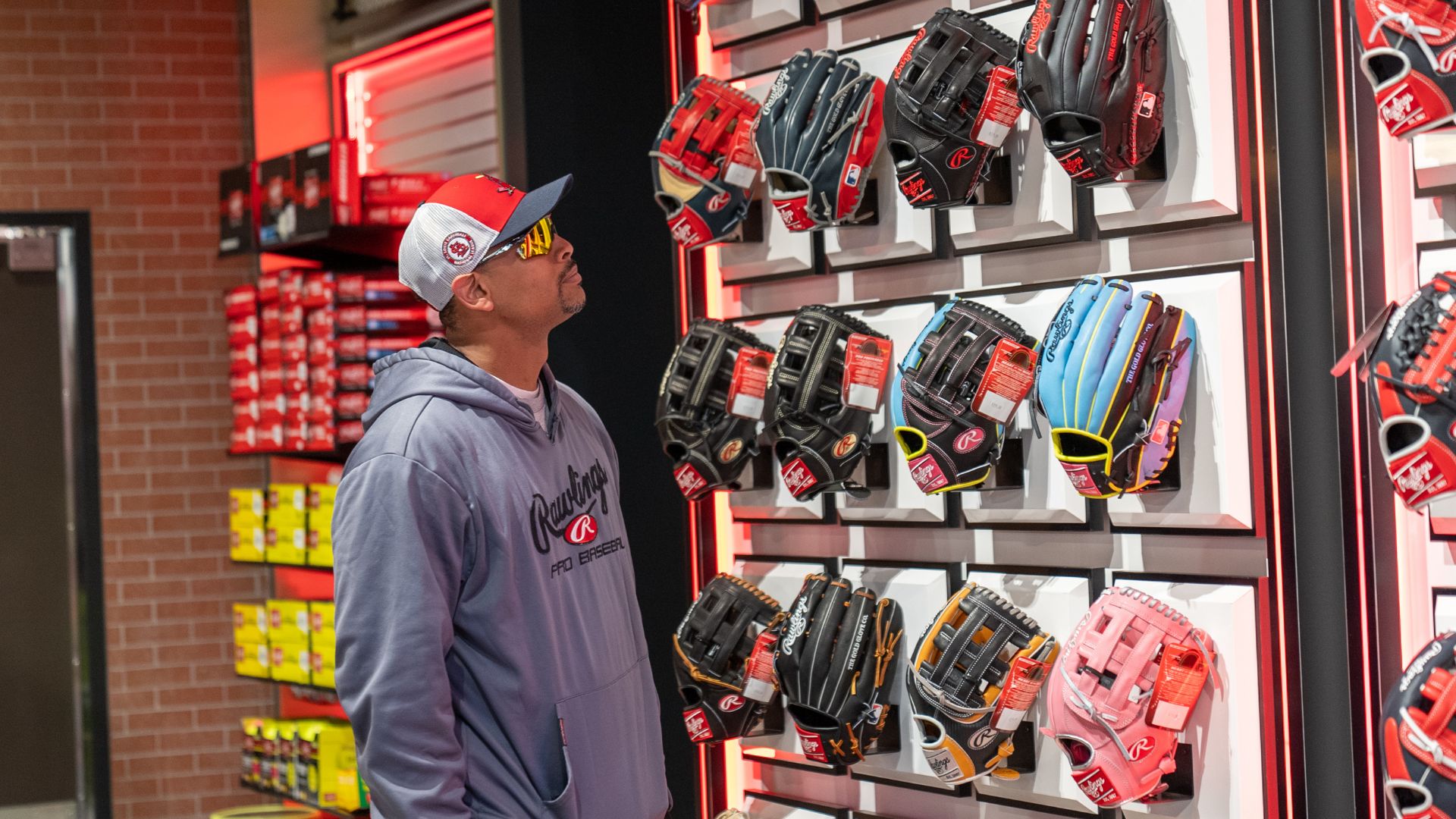 A player shops for baseball gloves at the Rawlings Experience in St. Louis.