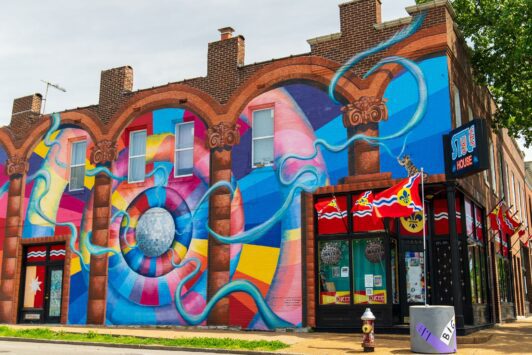 The exterior of STL-Style on Cherokee Street has a colorful mural.