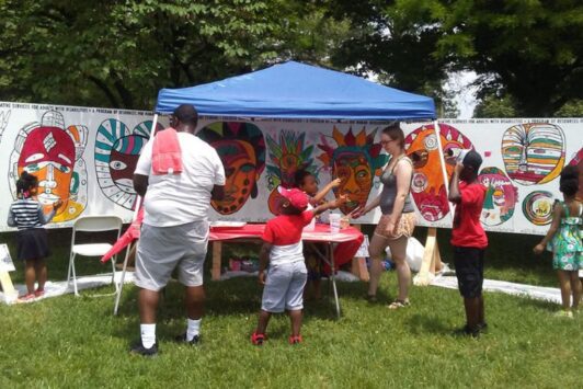 People create arts and crafts during the St. Louis African Arts Festival.