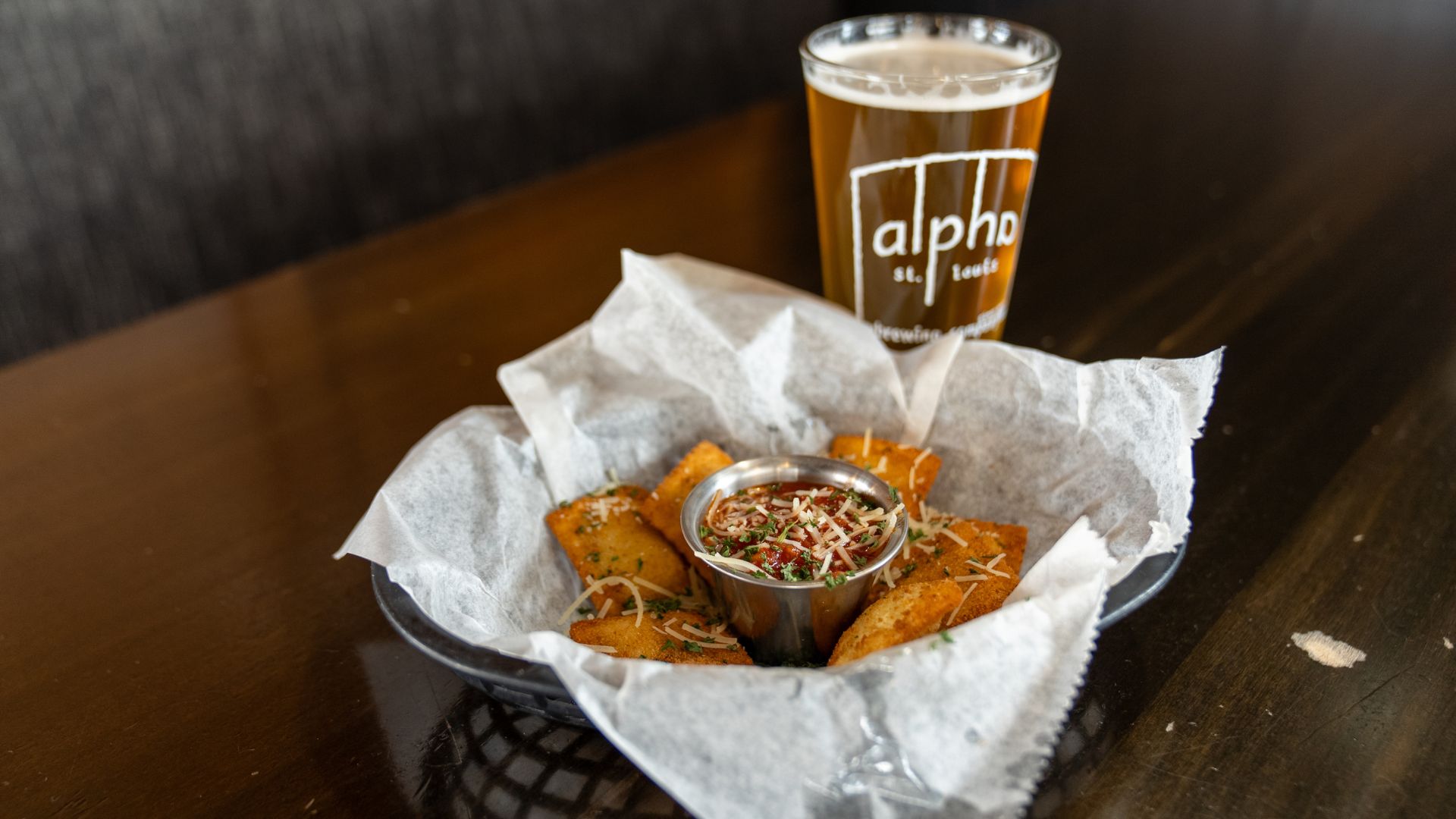 Alpha Brewing Company serves toasted ravioli alongside its sour beers.