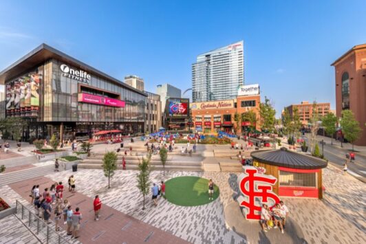 People gather in Together Credit Union Plaza at Ballpark Village before a St. Louis Cardinals game.