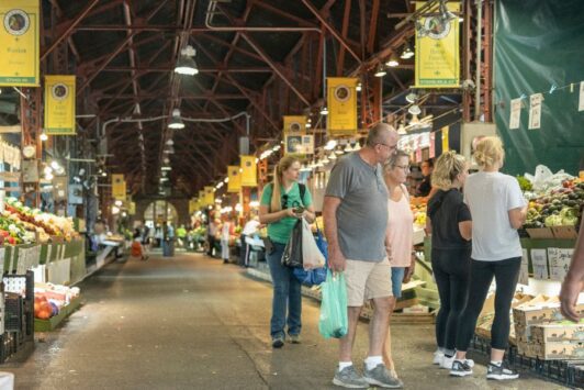 People shop for locally grown and made products at Soulard Farmers Market.