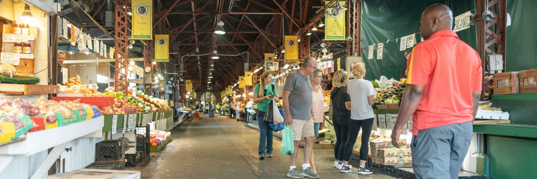 People shop for locally grown and made products at Soulard Farmers Market.