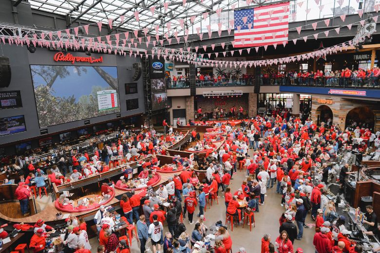 Hundreds of St. Louis Cardinals fans watch the game at Bally Sports Live! in Ballpark Village.