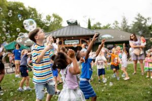 Kids play amongst bubbles at the Saint Louis Zoo.