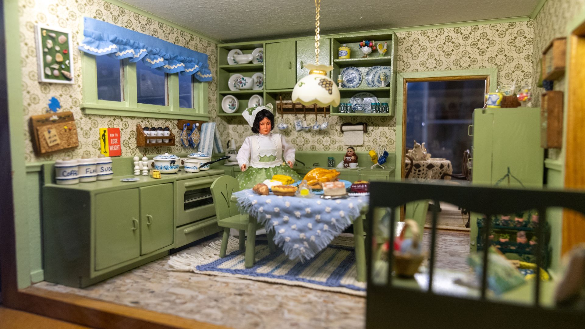 A room box features a kitchen from the 1920s.