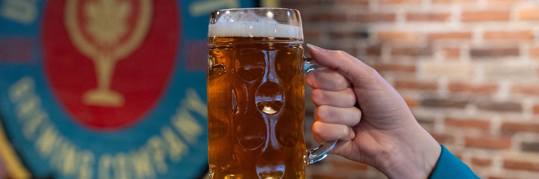 Someone raises a beer stein at Urban Chestnut Brewery.