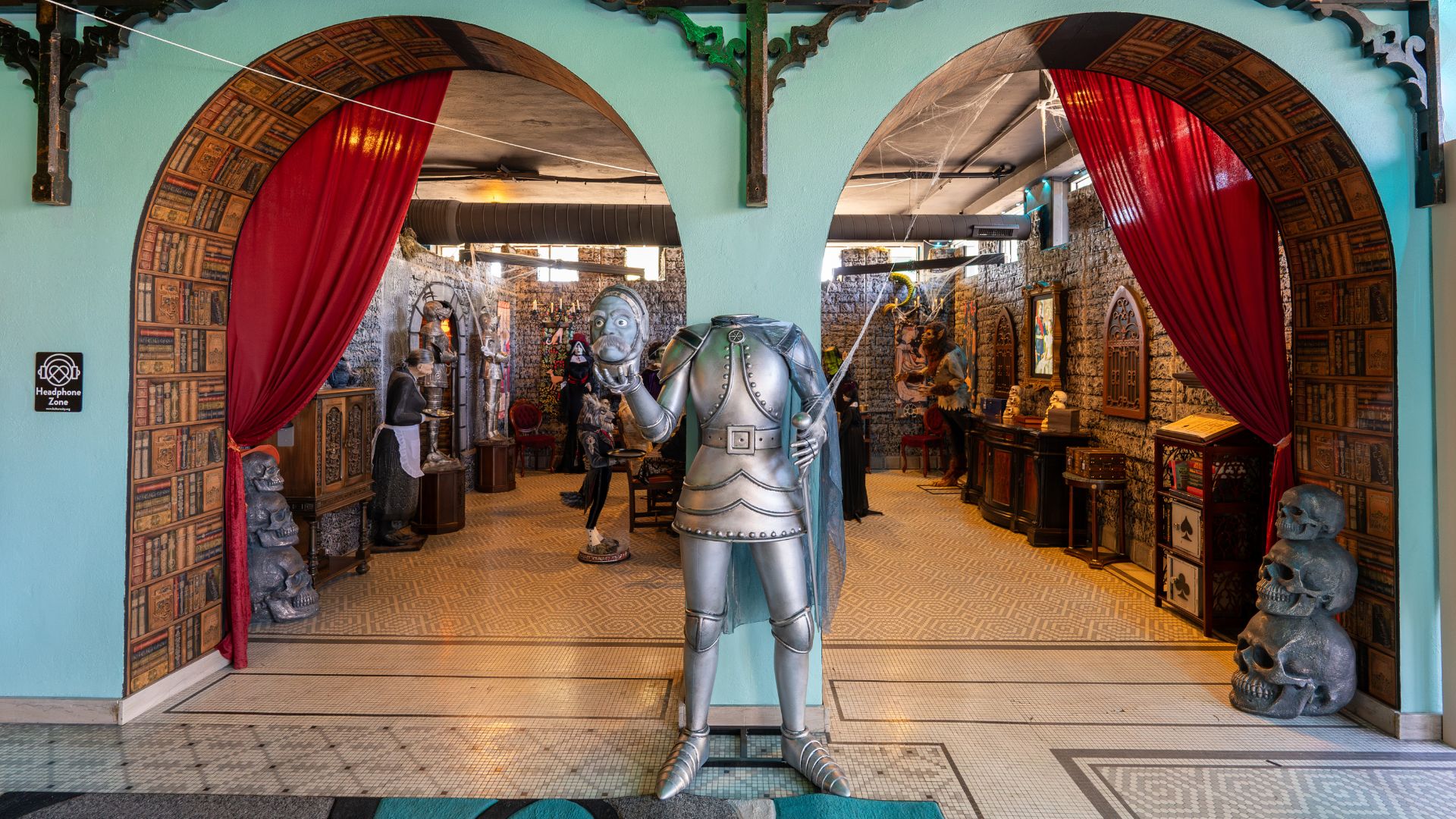 A suit of armor holding its own head leads into Lionheart Castle.