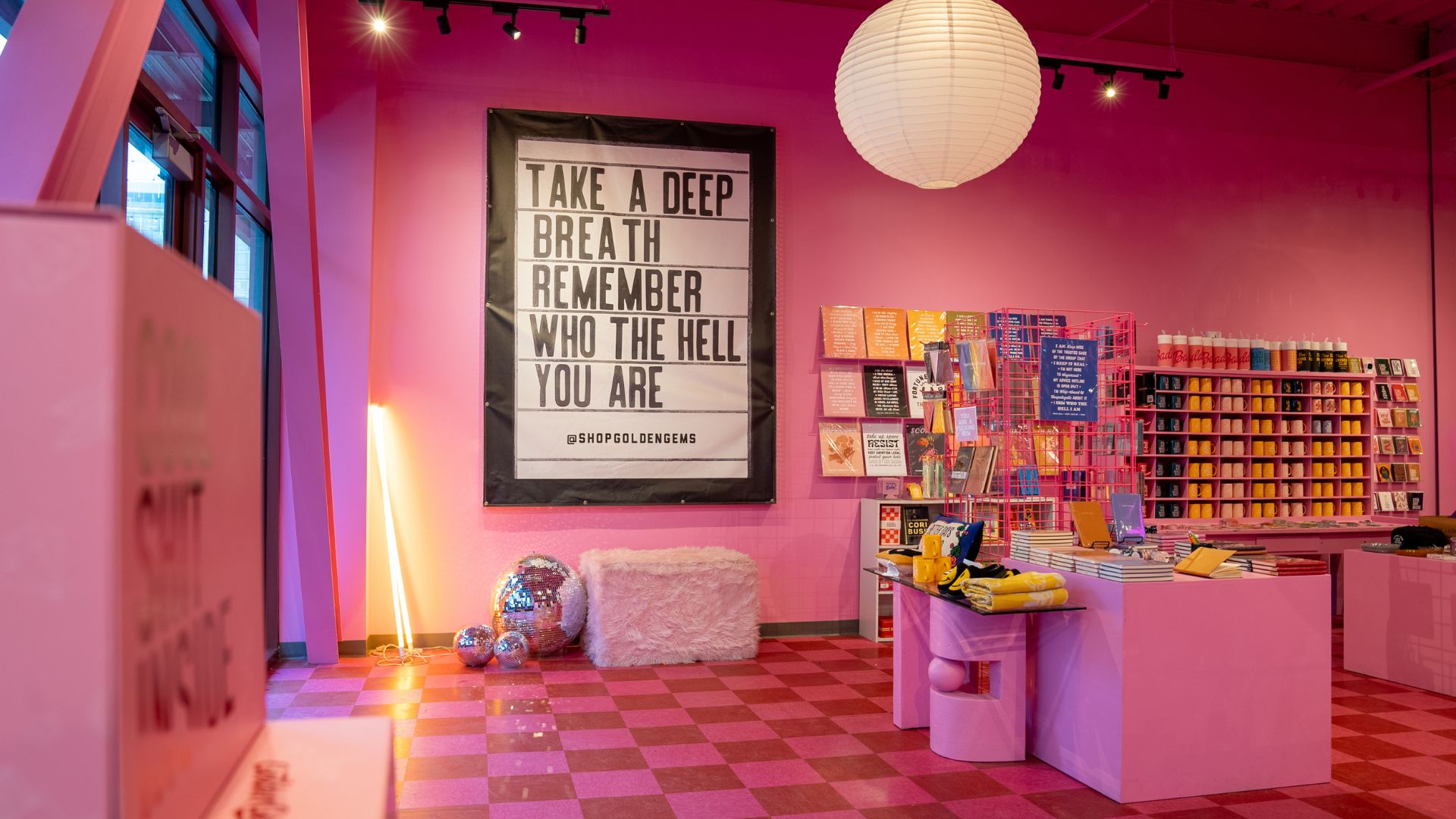 At Golden Gems in City Foundry STL, mantras such as Take a Deep Breath, Remember Who the Hell You Are decorate the walls and the products.