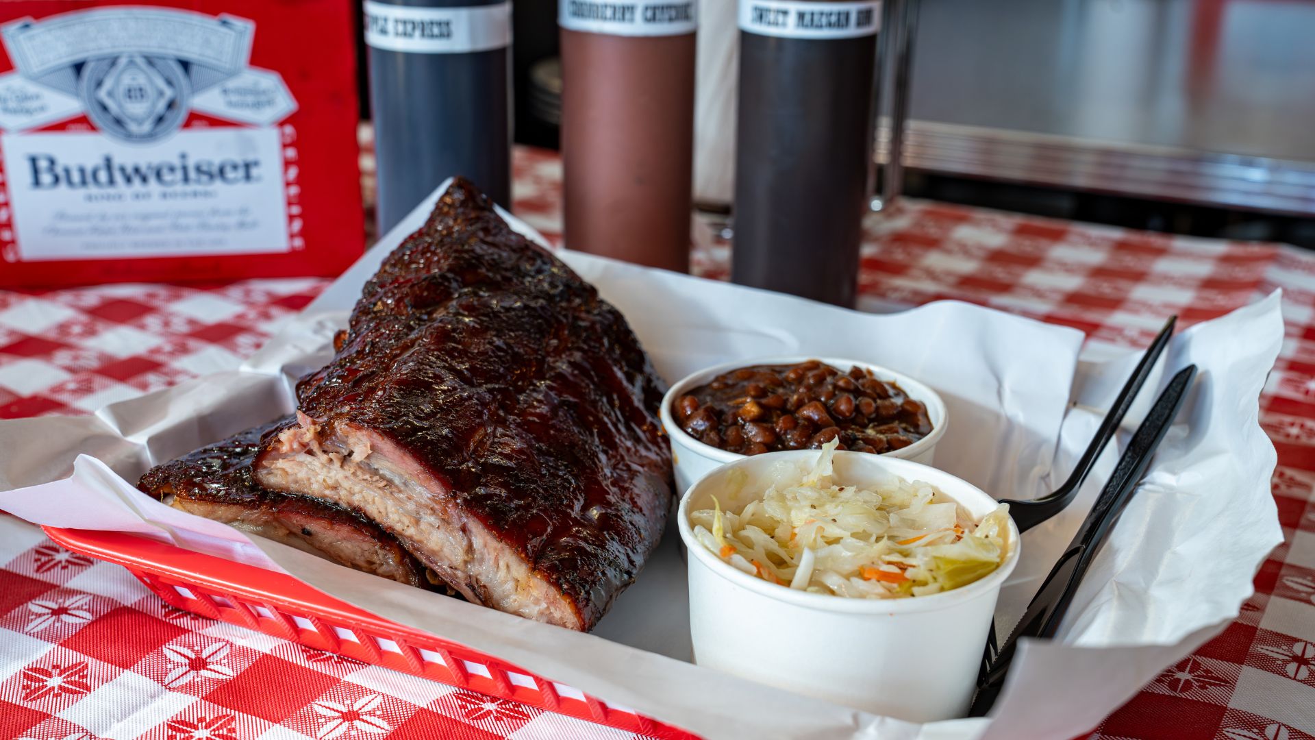 Bogart's Smokehouse in Soulard is known for its apricot-brûléed ribs, paired here with pit beans and coleslaw.