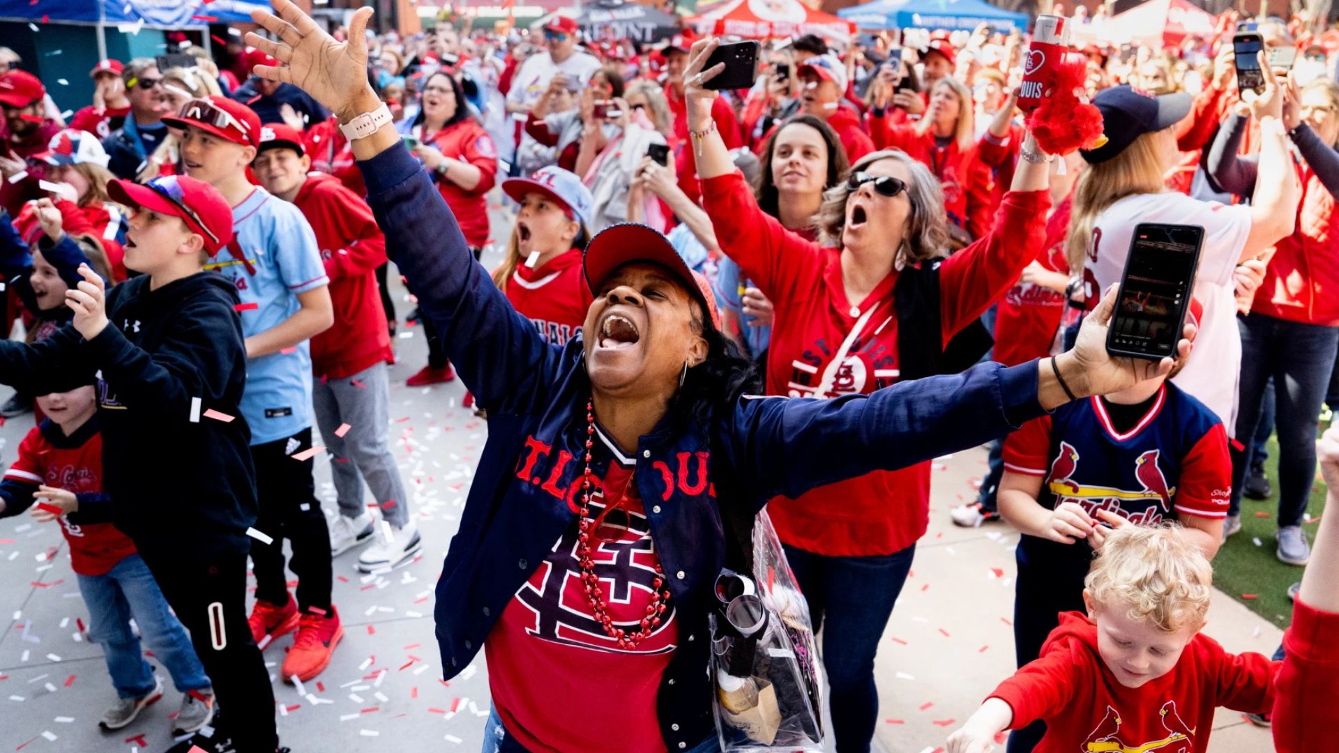 Cardinal fans rally for a game during summer in St Louis.