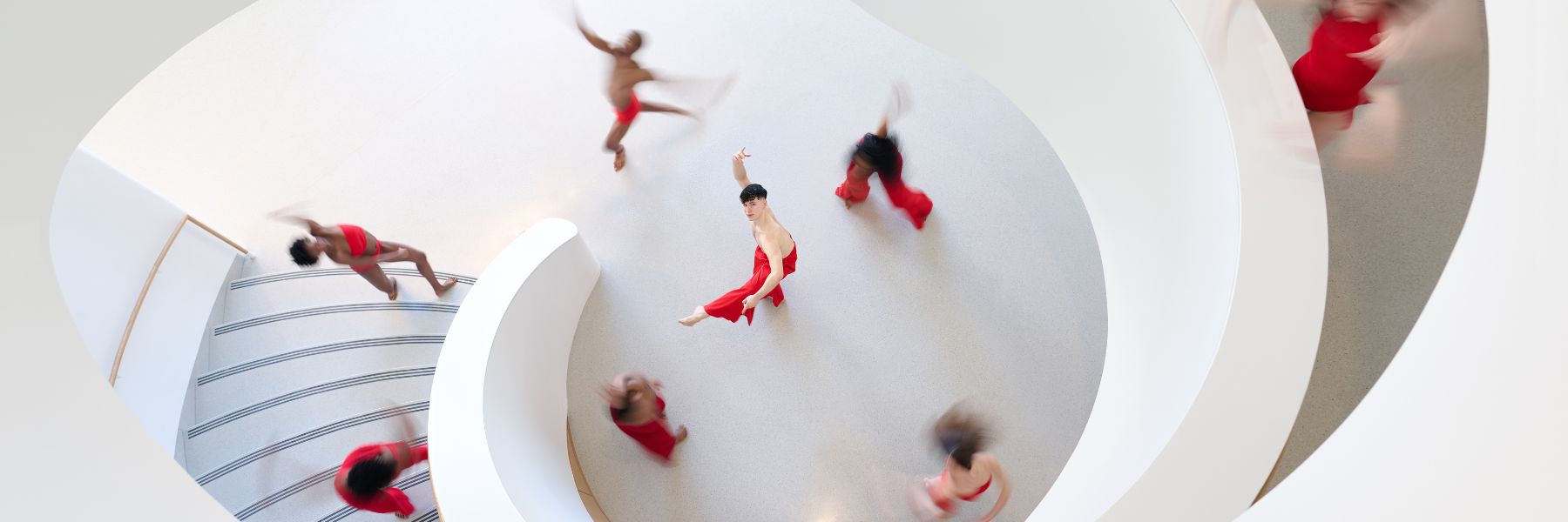 Saint Louis Dance Theatre performers dance through the white, spiral staircase at Powell Hall in Grand Center.