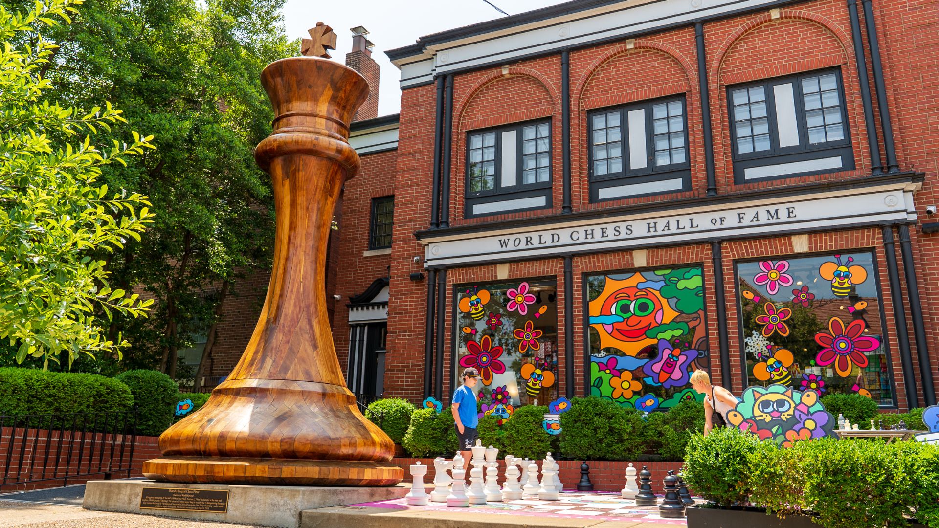 A mother and son play giant chess outside of the World Chess Hall of Fame and Galleries in St Louis.