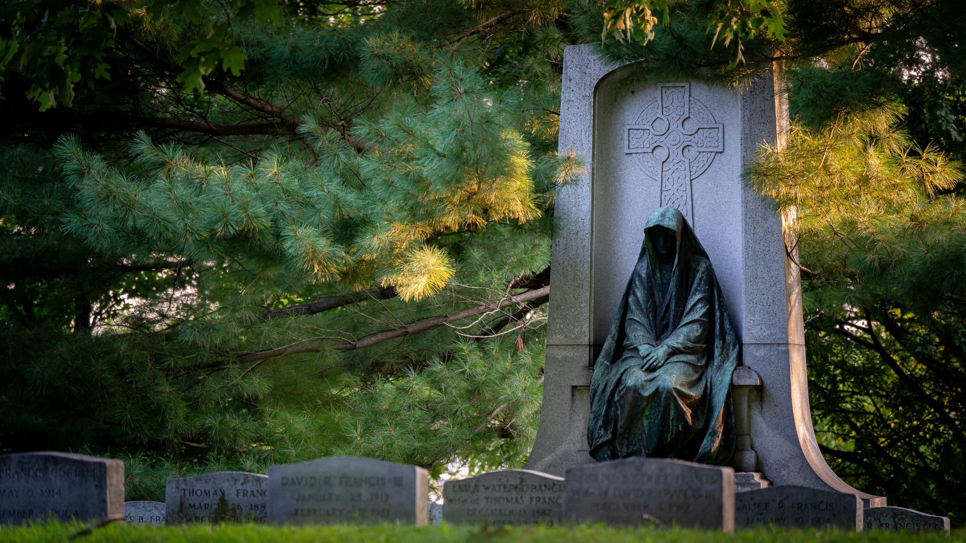 A hooded figure marks a monument in Bellefontaine Cemetery and Arboretum.