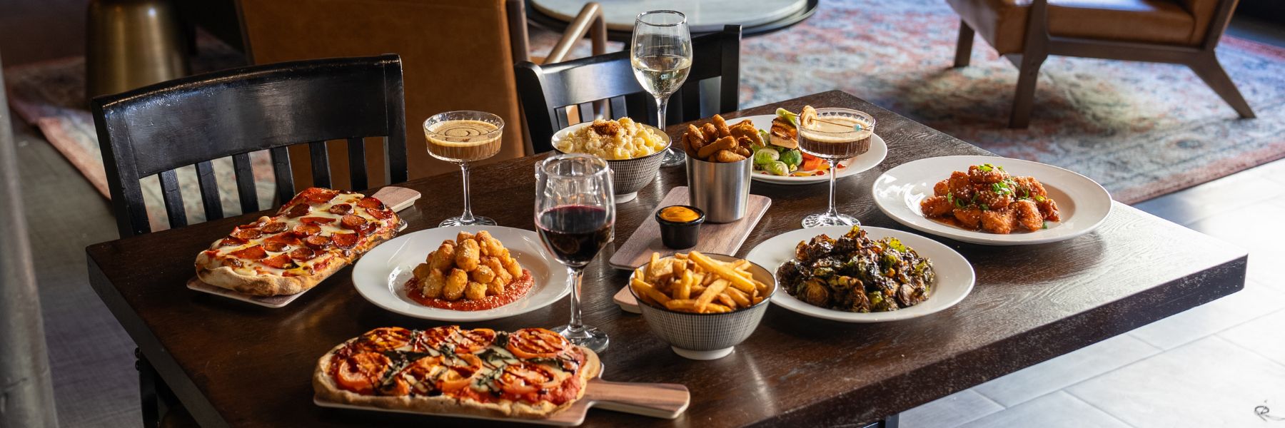 Food and wine cover the table of Buddy's Wine Bar and Bistro, one of the best restaurants near America's Center.