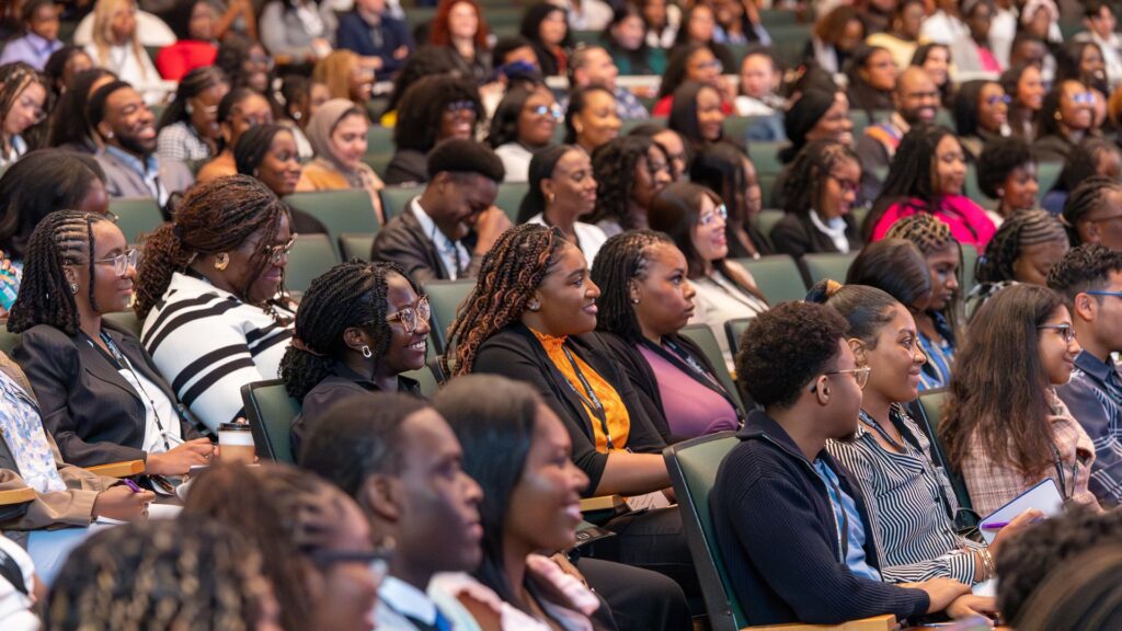 Guests smile during a lecture at the Ferrara Theatre at America's Center in St Louis.