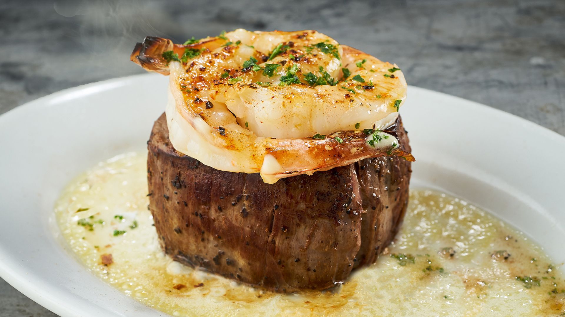 Shrimp tops a filet at Ruth's Chris Steak House in St Louis.