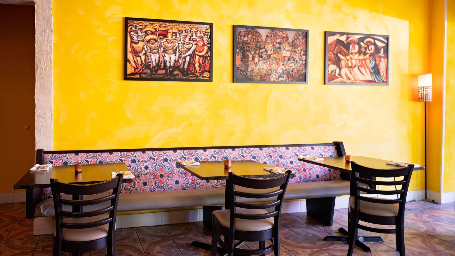 El Molino del Sureste features golden yellow walls, Maya patterns and Mexican art.