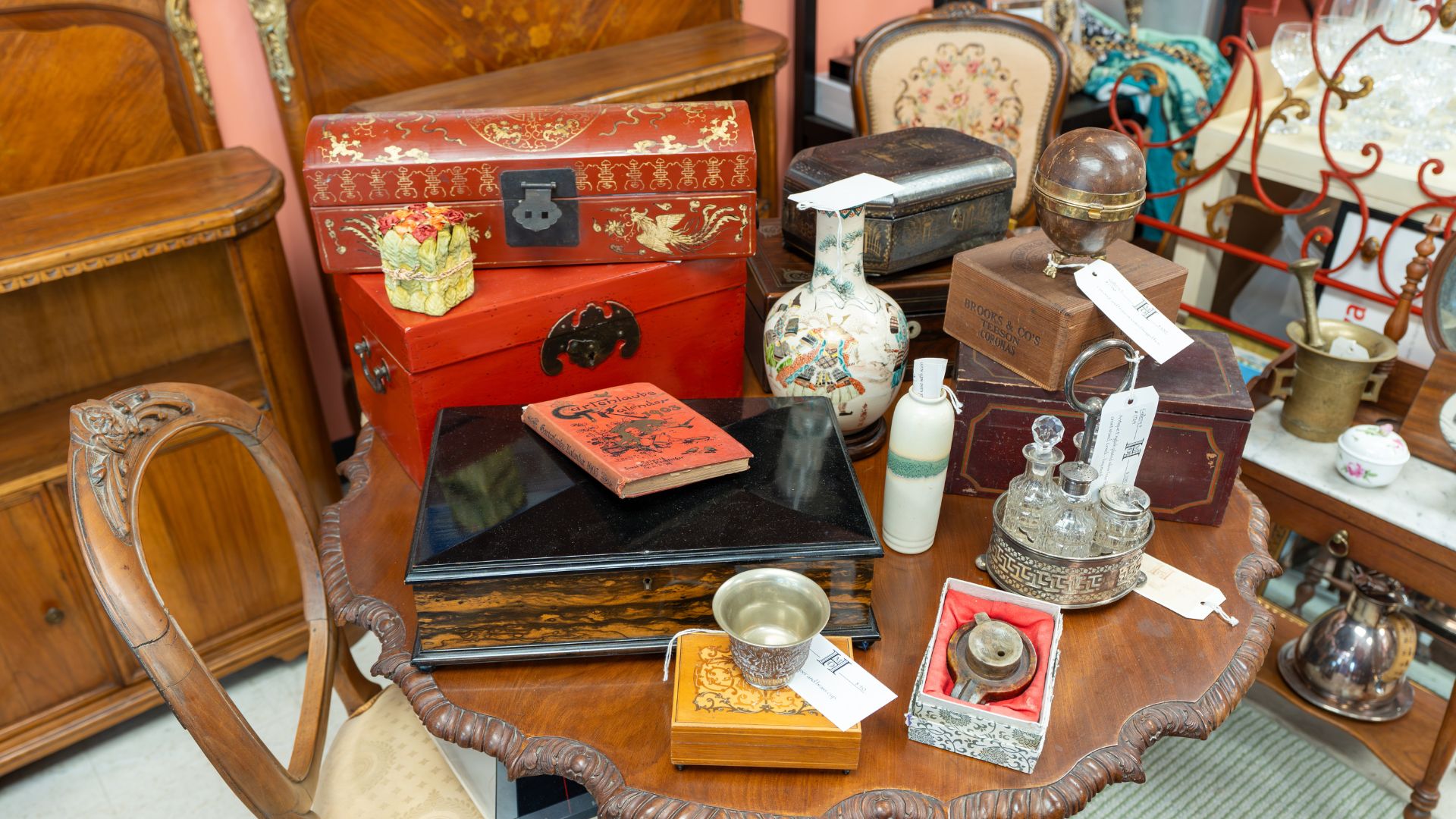 Vintage trinkets line a table at Mark O. Howald Antiques & Fine Art in St Louis.