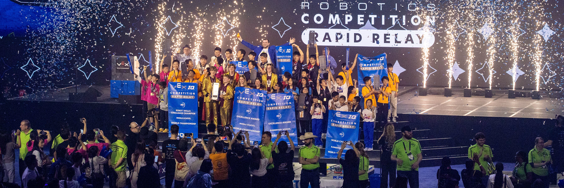 Vex Robotics Competitors on stage.