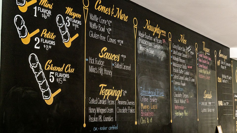 Clementine’s chalkboard menu displaying ice cream flavors, cones, toppings and beverages.