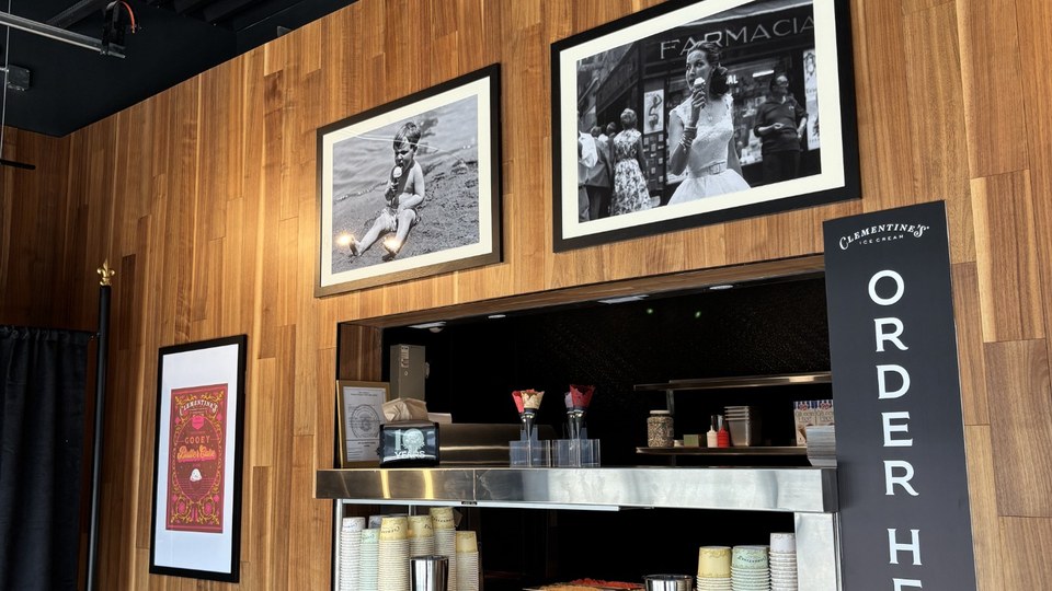 Clementine’s St. Charles order counter with wood-paneled walls and framed photographs