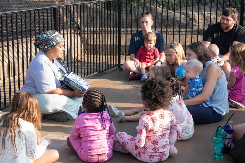 Families in pajamas gather for storytime during Pajama Party at the Saint Louis Zoo.