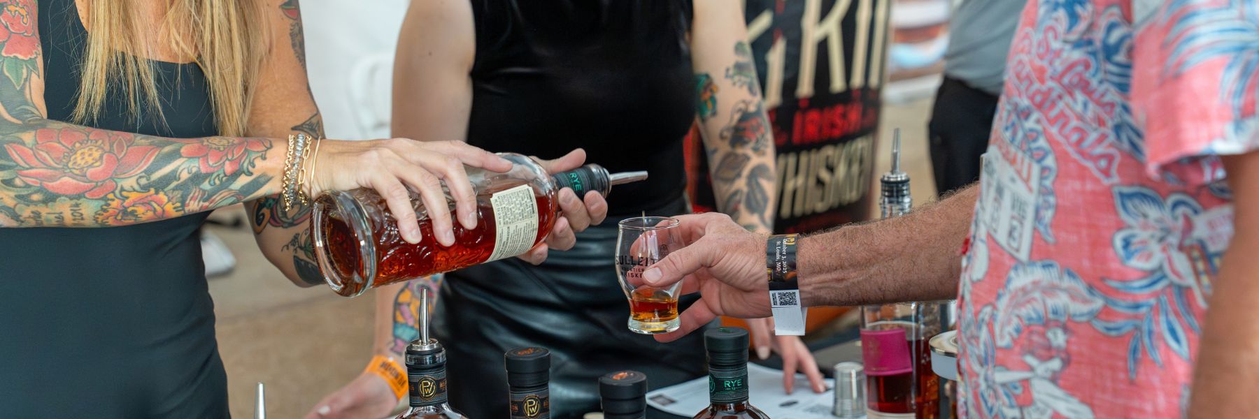Glasses are filled at the St Louis Bourbon Festival.