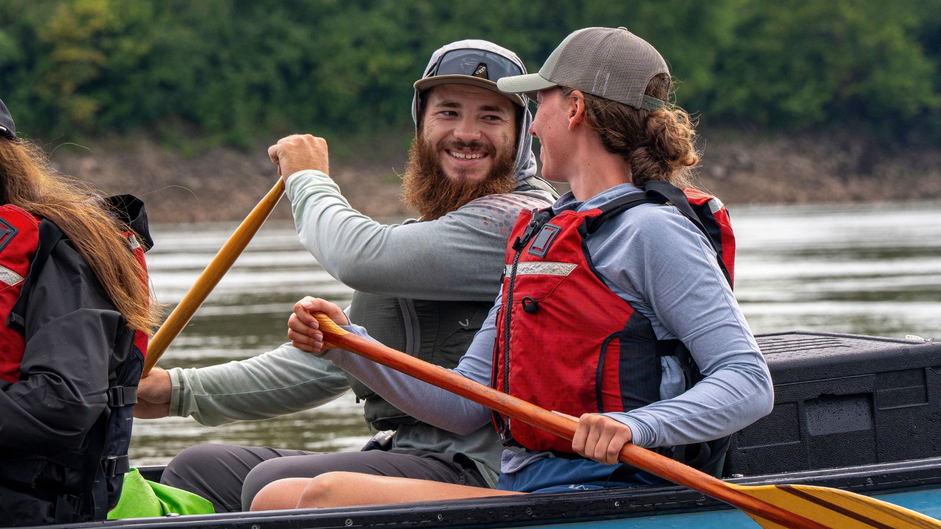 A couple paddles the Missouri river on an expedition with Big Muddy Adventures, which offers unique date ideas in St Louis.