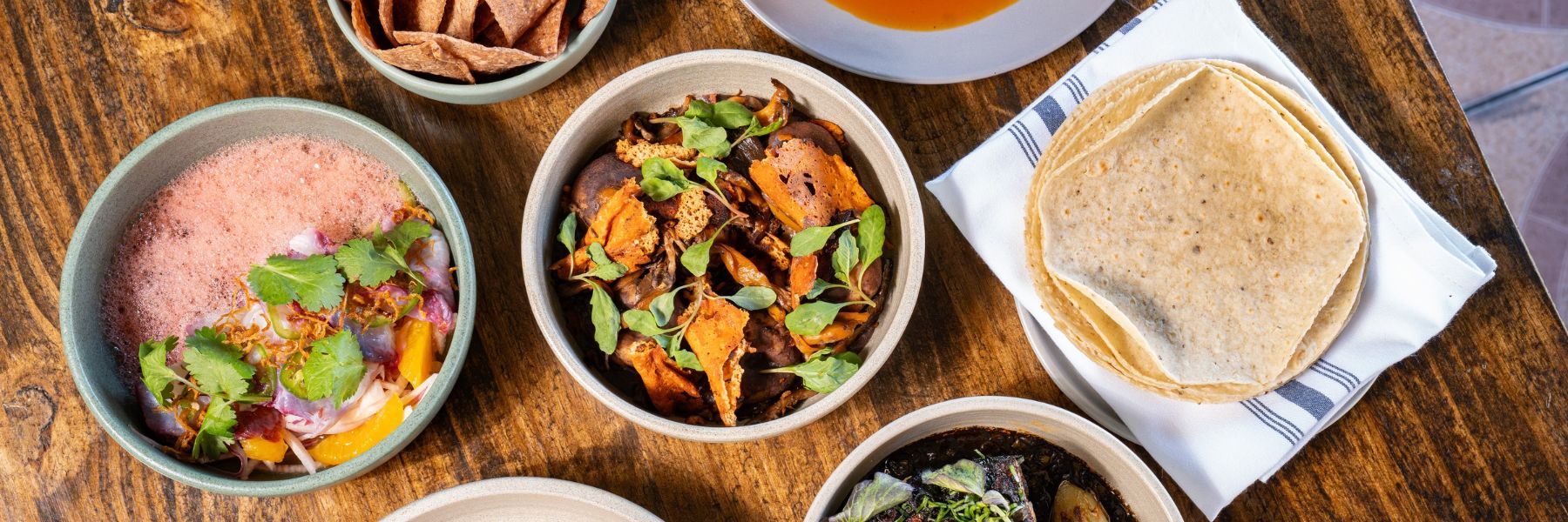 A spread of regional Mexican dishes lines a table at El Molino del Sureste in St Louis.